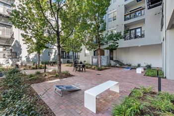 Gaming courtyard with fire pit and water feature